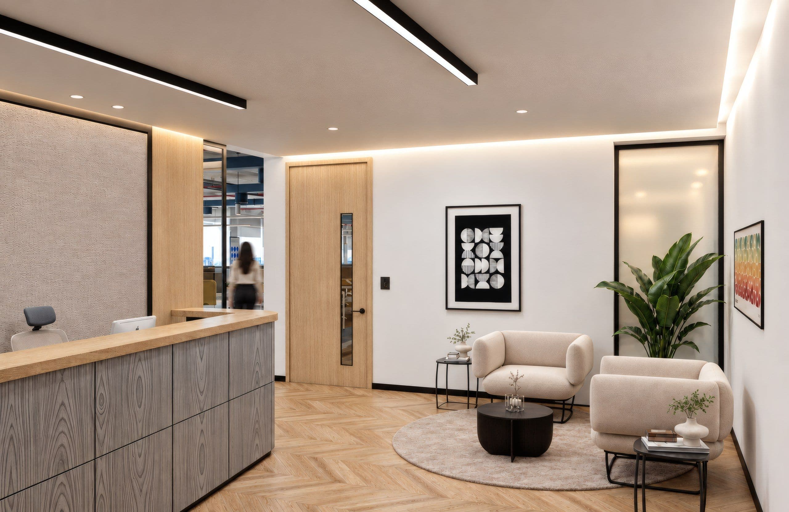Reception lobby with a timber reception desk and cream armchairs
