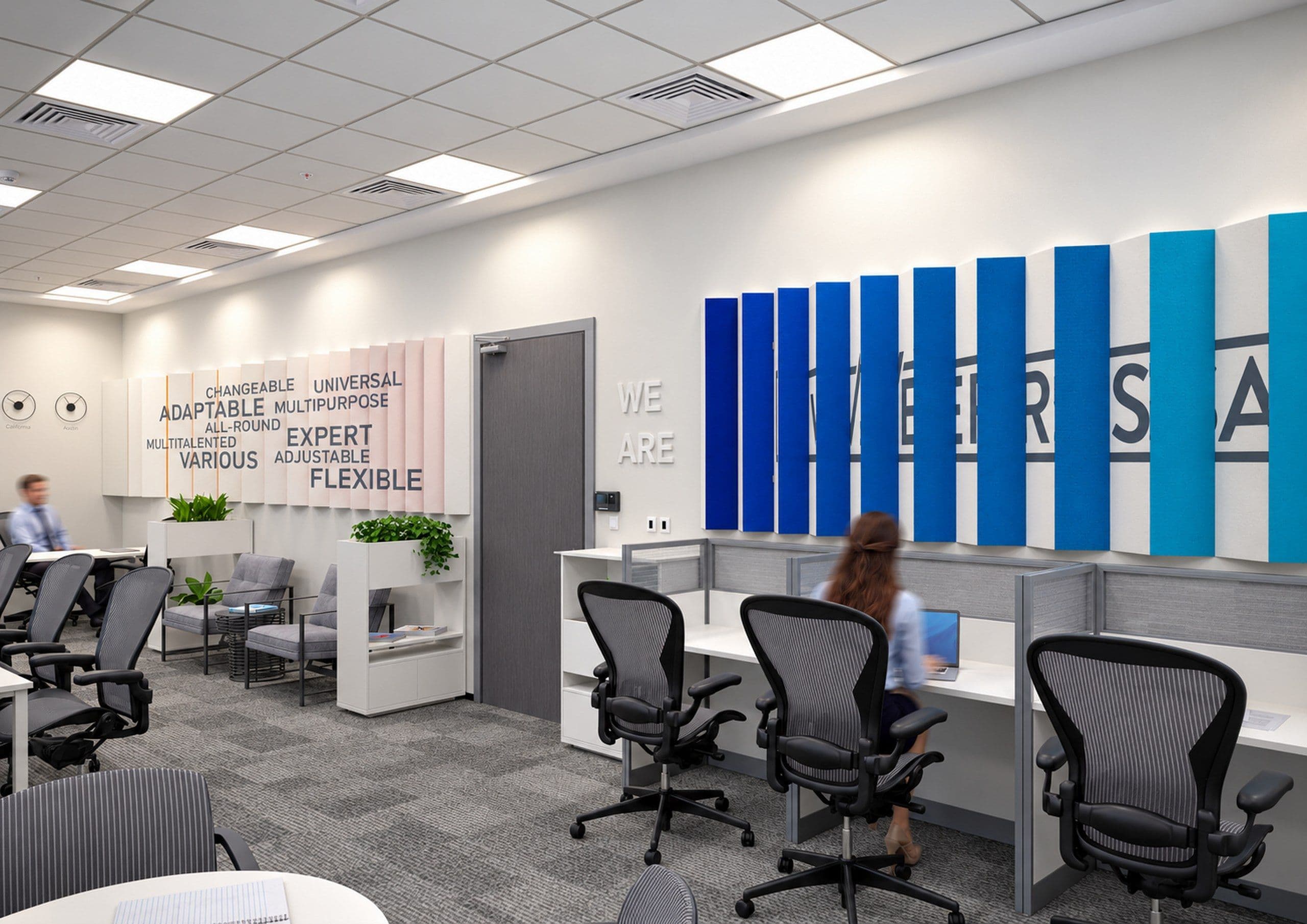 Open workspace with a blue acoustic panel wall spelling the company name