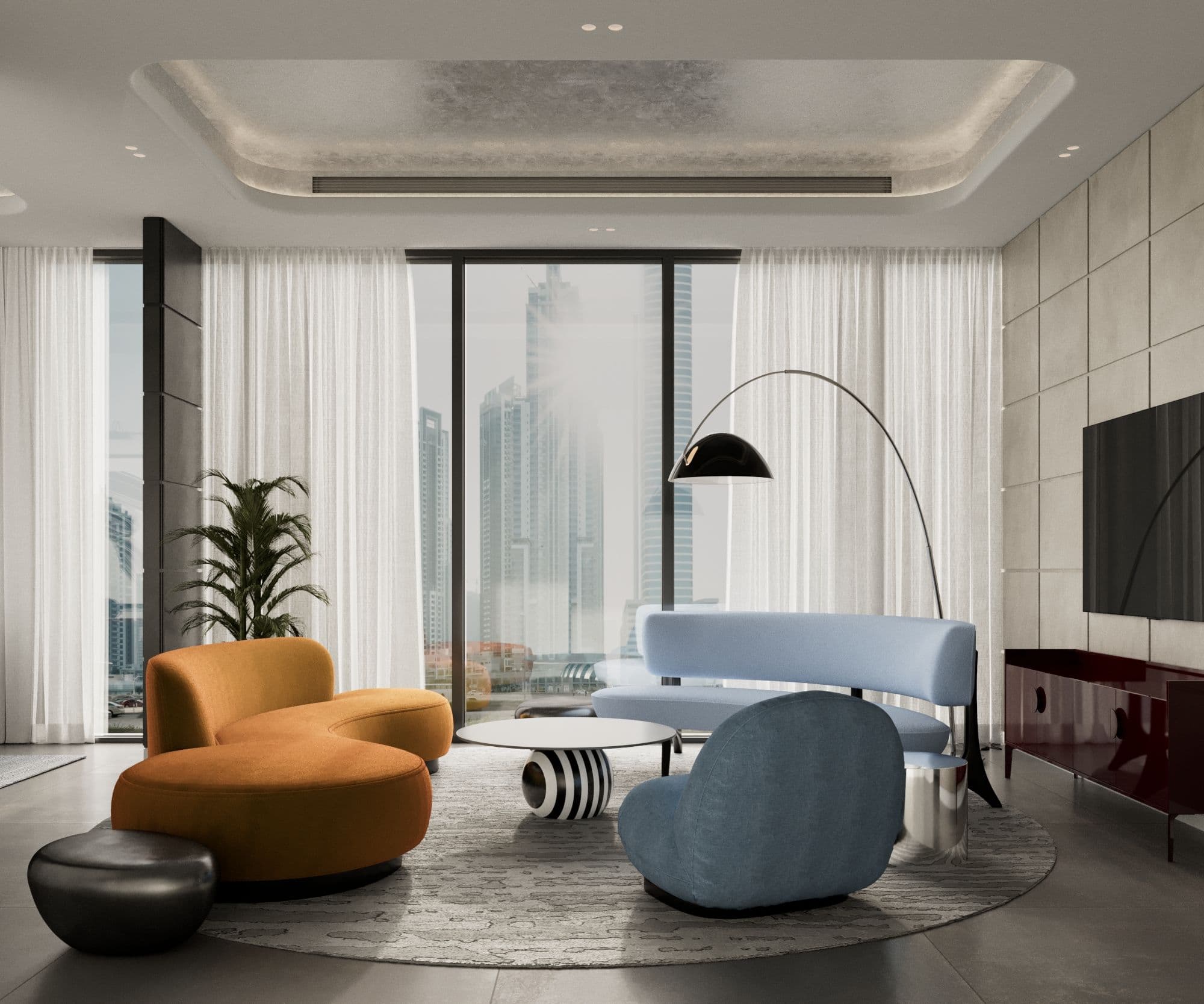 Living room with a burnt orange curved sofa, a blue sofa and an arc floor lamp by the window