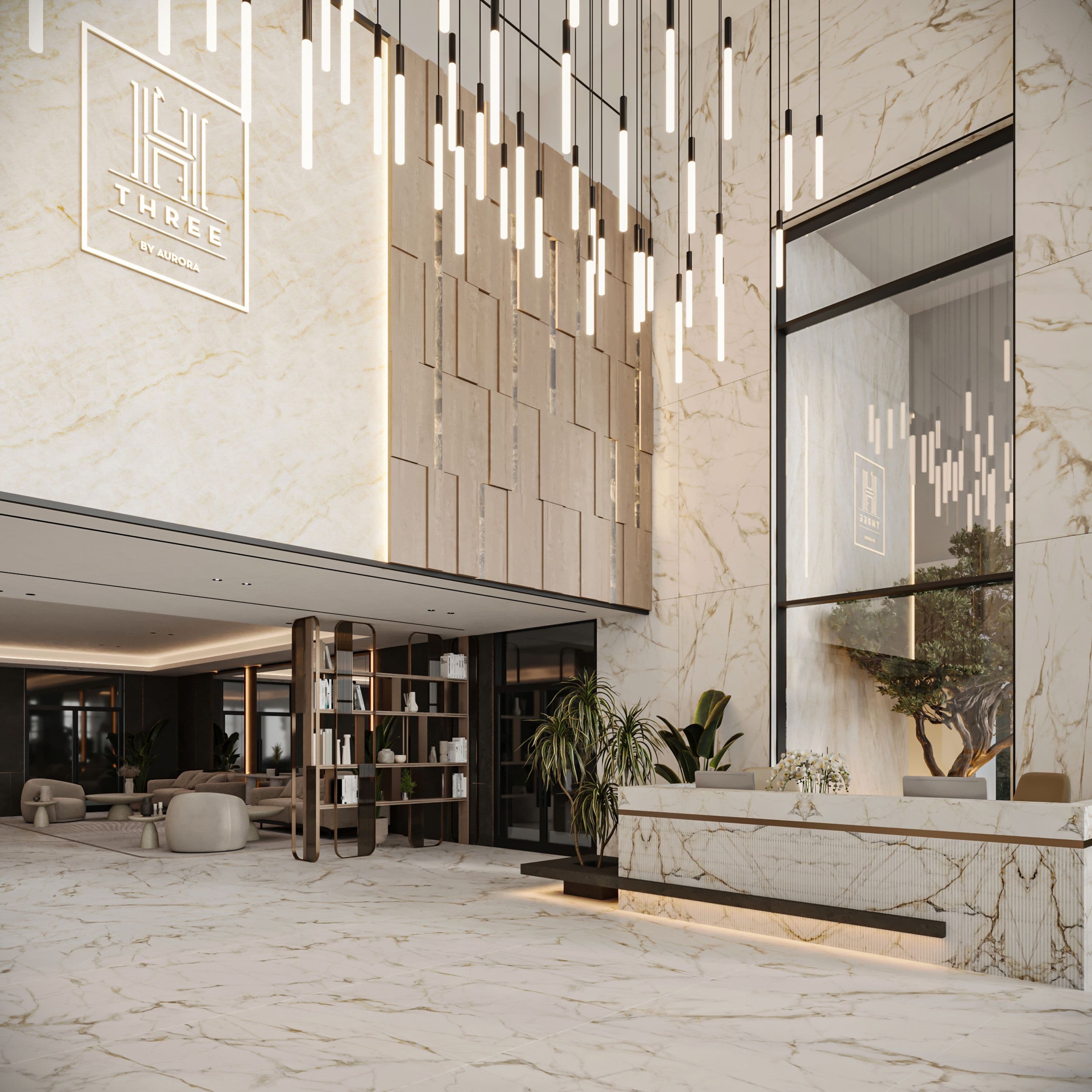 Marble lobby wall carrying the H Three monogram, under hanging tube lights
