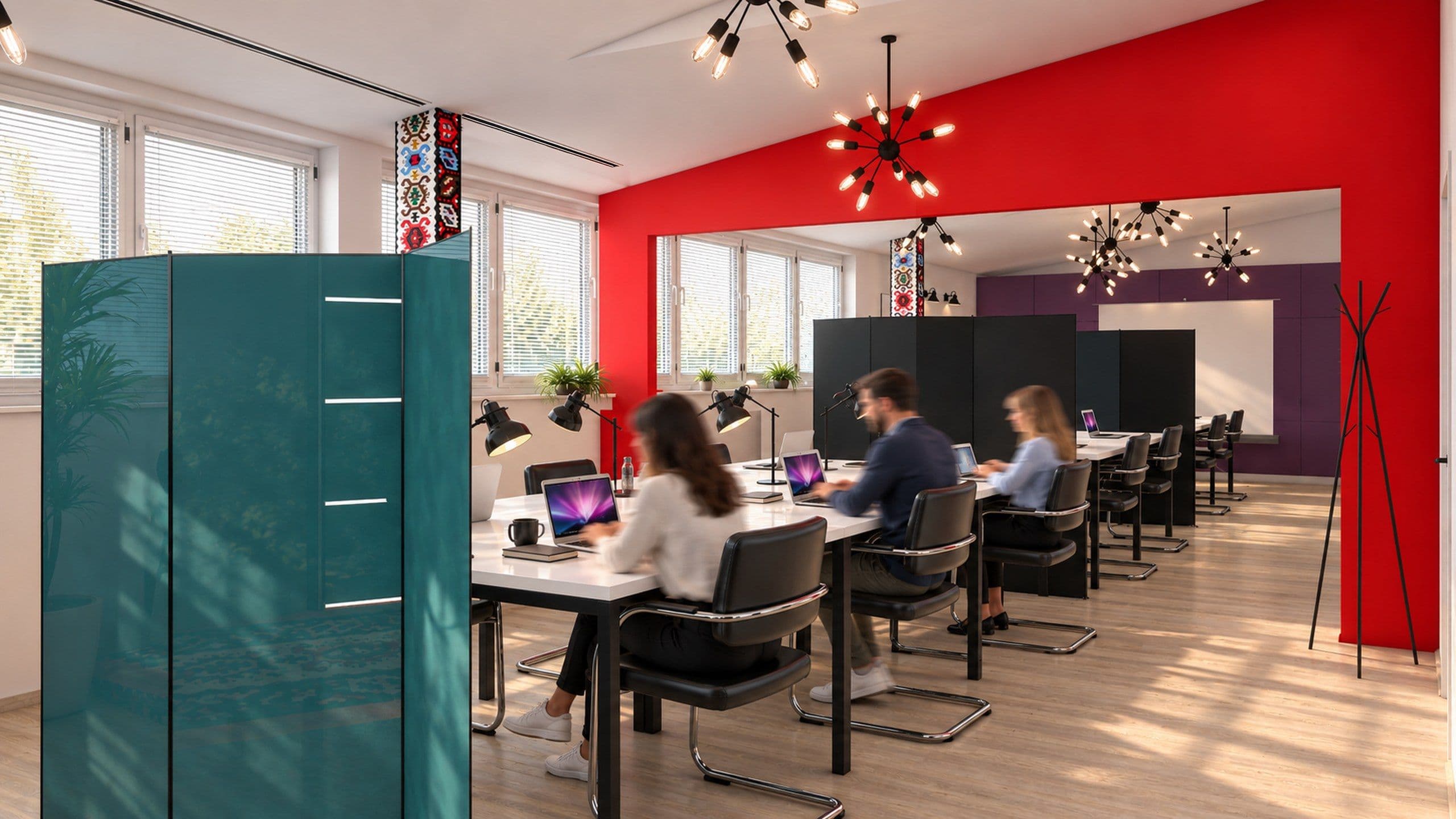 Desks beside the windows with a red wall and a teal storage unit