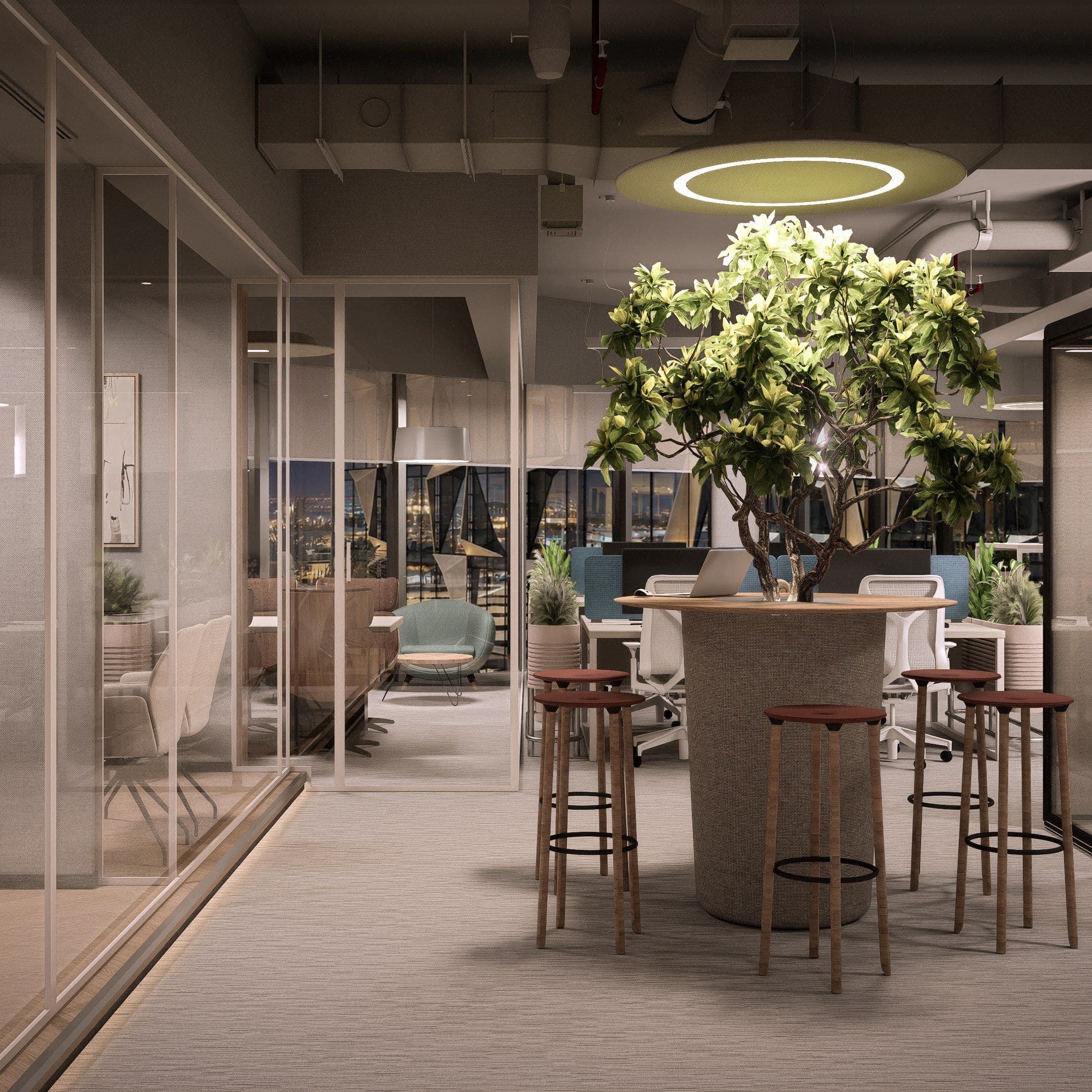 Standing table under a ring light, with planting and glazed meeting rooms